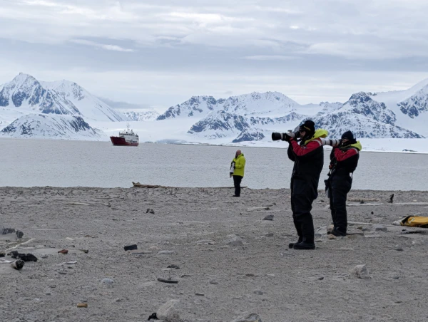 travelers taking photos in arctic