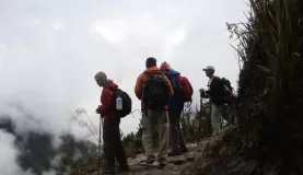 Travelers overlooking the overwhelming landscape of the Andes on the Inca Trail