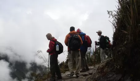 Travelers overlooking the overwhelming landscape of the Andes on the Inca Trail