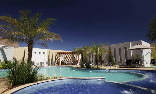 Relax by the pool at Nadai Confort Hotel on your Brazil tour