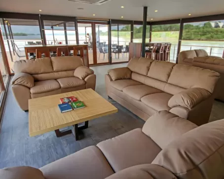 Relax in the sitting lounge aboard the M/V Anakonda