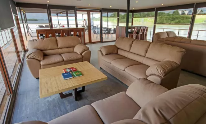 Relax in the sitting lounge aboard the M/V Anakonda