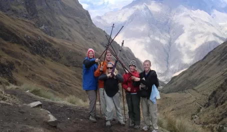 Travelers celebrating on the top of Dead Womans Pass on the Inca Trail