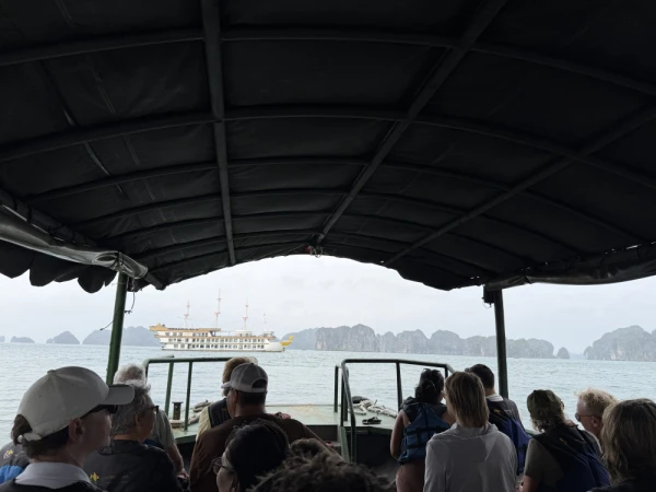 Travelers cruising through Ha Long Bay