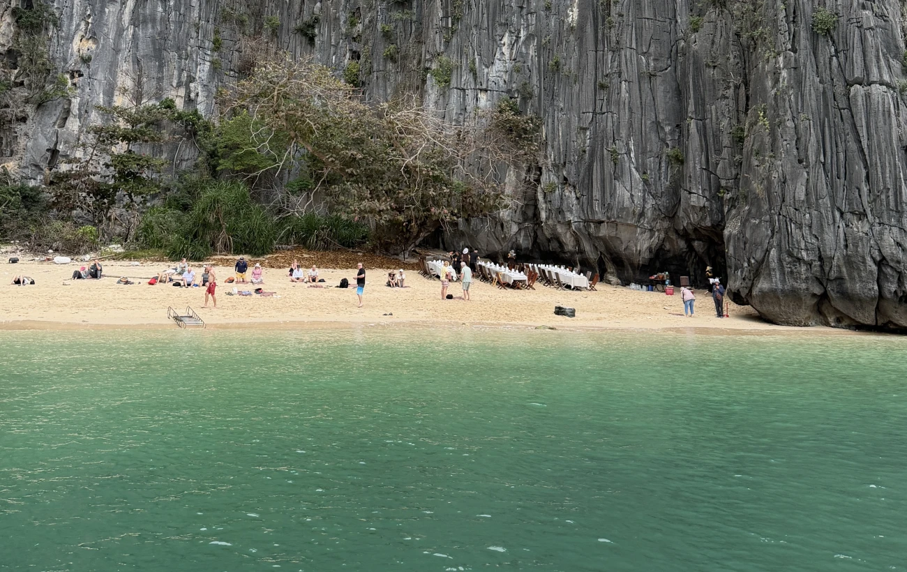beach escape highlighting the towering cliffs of Ha Long Bay