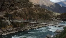 Crossing a foot-bridge at the beginning of the Inca Trail