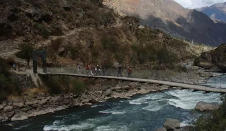 Crossing a foot-bridge at the beginning of the Inca Trail