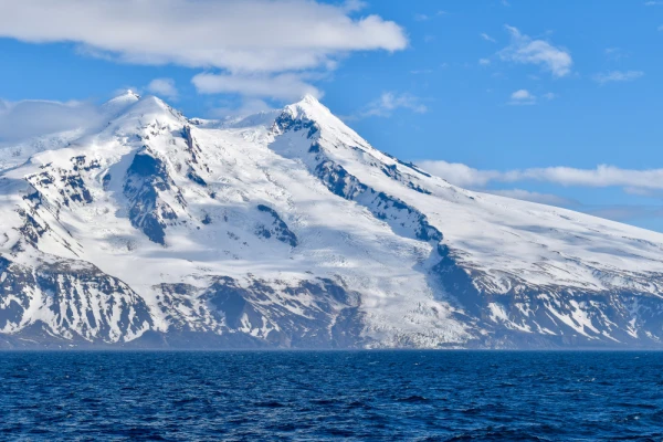 Jan Mayen northwestern slope of Beerenberg Volcano and shoreline featuring Weyprecht Glacier from the North Greenland Sea