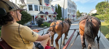 Riding through town on a carriage tour, Mackinac Island