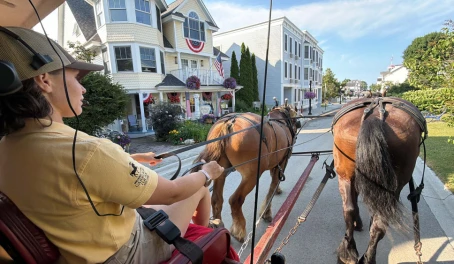 Riding through town on a carriage tour, Mackinac Island