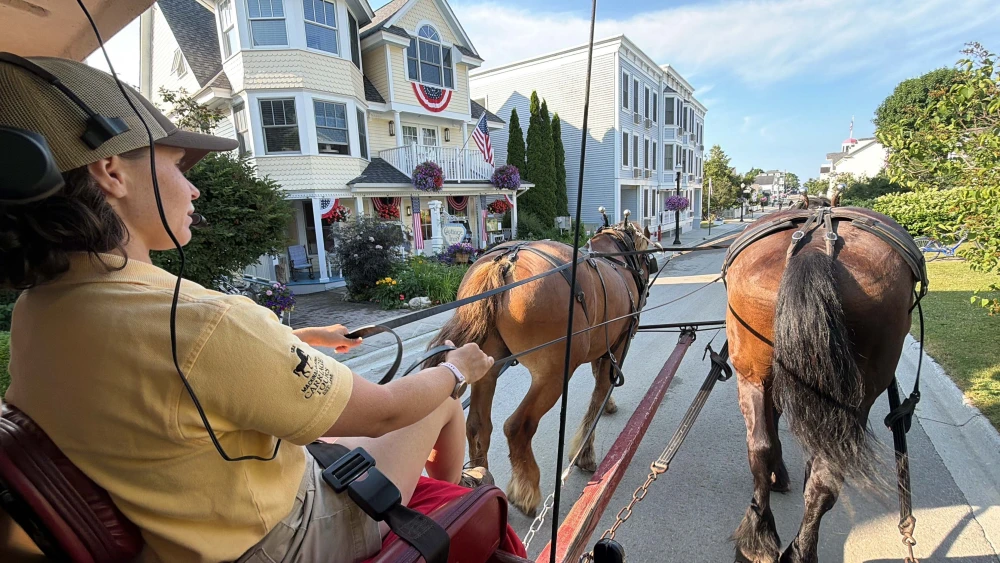 Riding through town on a carriage tour, Mackinac Island