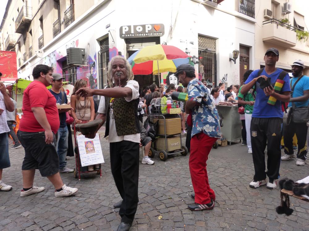 A parade of Caribbean drummers makes their way through the crowds at the San Telmo Sunday Market
