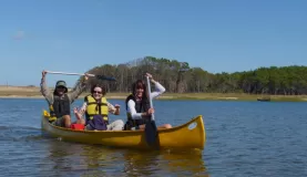 Suzy enjoys the canoe ride across Laguna Rocha in Uruguay