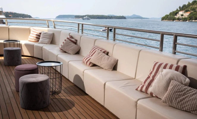 Outdoor lounge area is located on the deck of the luxury small cruise ship MS Mama Marija II.