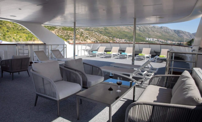 The shaded outdoor lounge and deck area on the MS Mama Marija II
