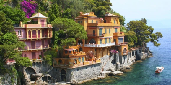 Coast of Portofino, Italy, featuring historic cliffside villas and lush landscapes