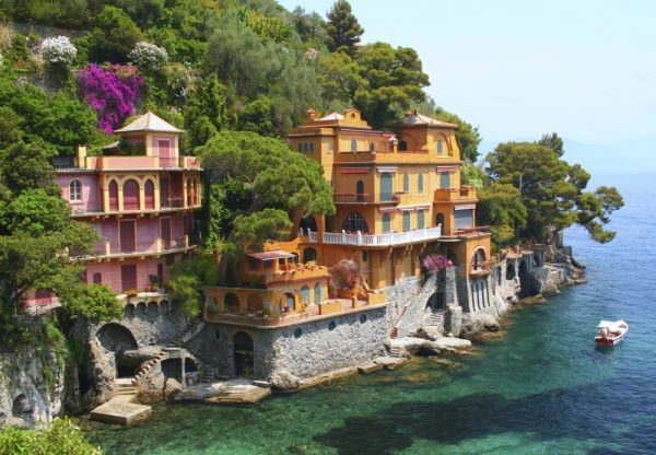 Coast of Portofino, Italy, featuring historic cliffside villas and lush landscapes