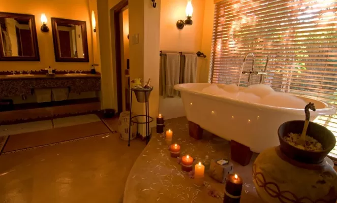 Enjoy a relaxing bath in Chobe Chilwero's luxurious bathroom