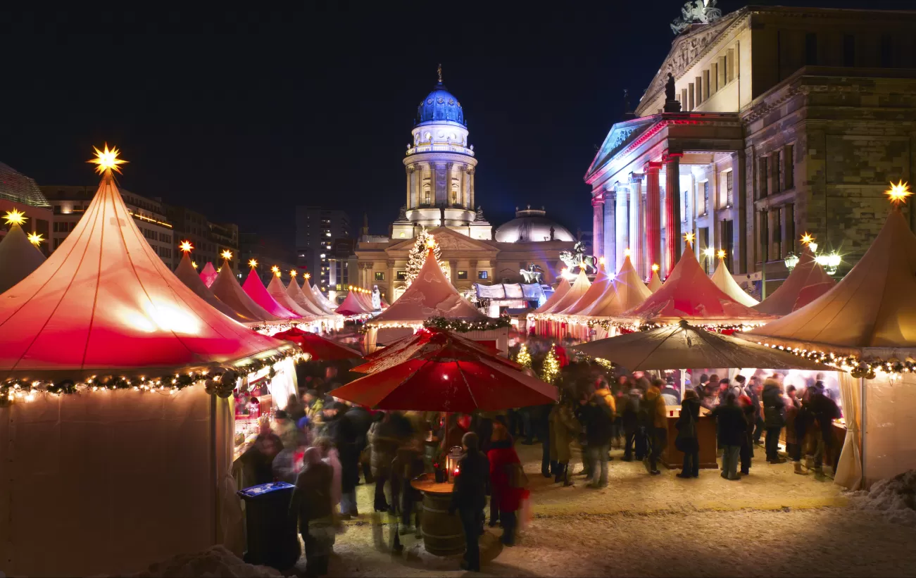 Lights brighten the evening at this bustling Christmas Market