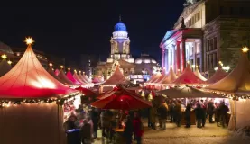 Lights brighten the evening at this bustling Christmas Market