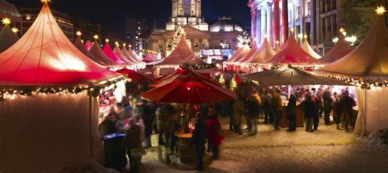 Lights brighten the evening at this bustling Christmas Market