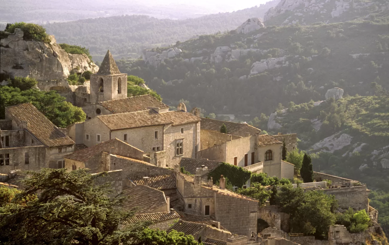 A village overlooks the rocky mountains of Europe
