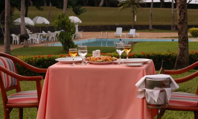 Enjoy fine dining by the pool at Pestana Sao Luis