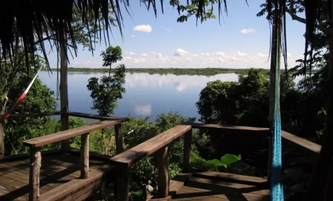 Enjoy the view from the deck at Lamanai Outpost Lodge