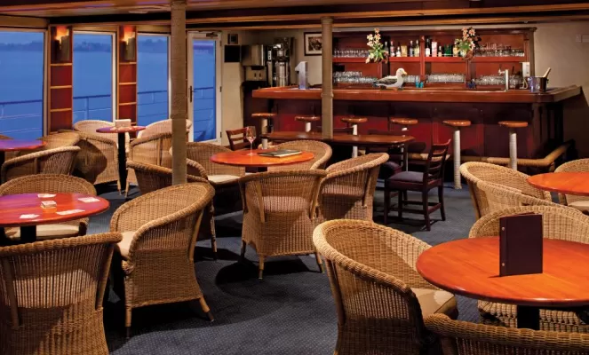 Enjoy a drink at the bar aboard the Safari Voyager.