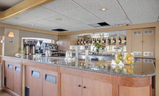 Enjoy a drink at the bar aboard the Safari Endeavour.