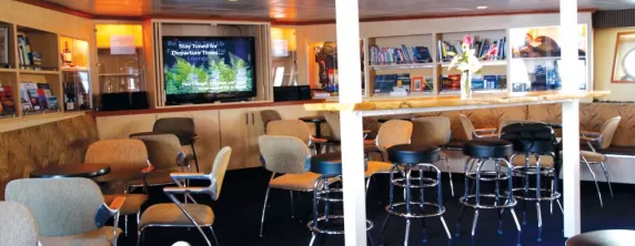 Relax in the bar aboard the Wilderness Discoverer.