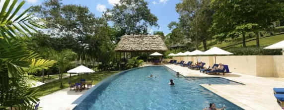 Relax in the pool at the Lodge at Chaa Creek