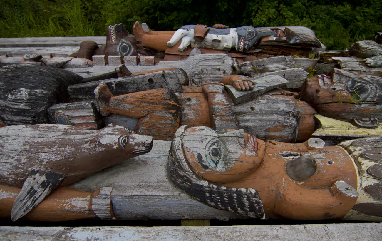 A pile of old totem poles.