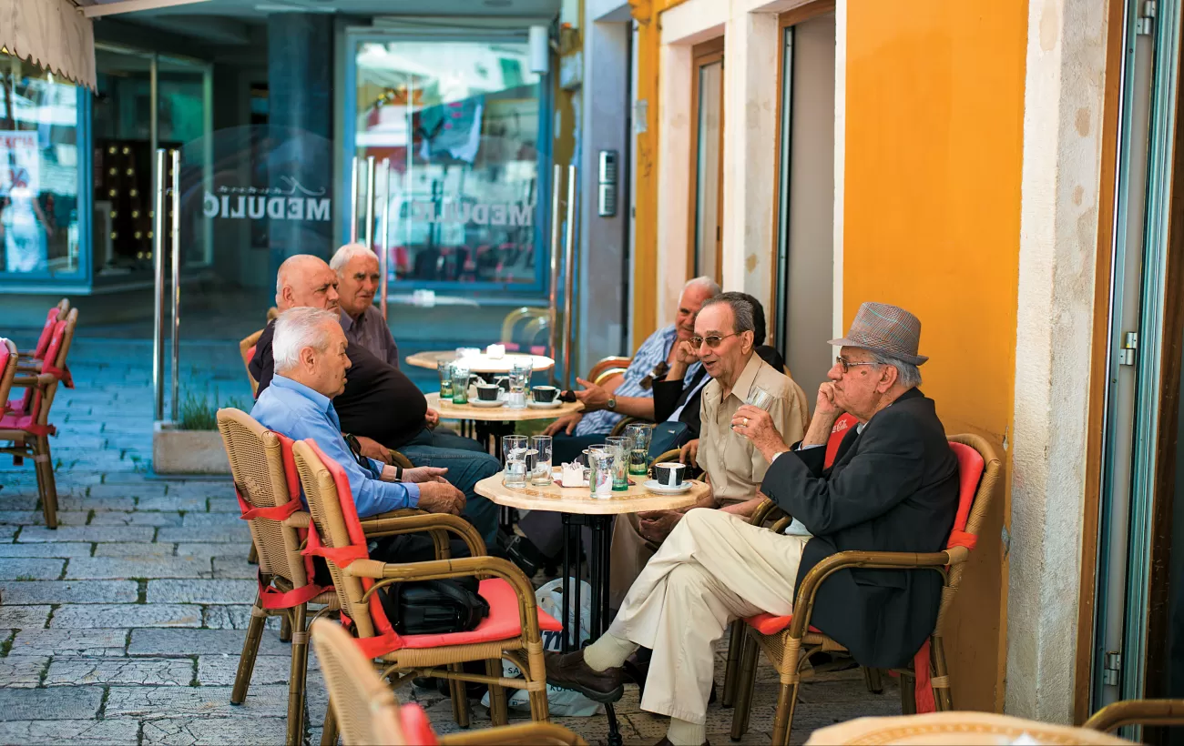 Locals sitting at a cafe in Croatia.