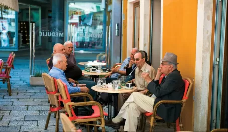 Locals sitting at a cafe in Croatia.