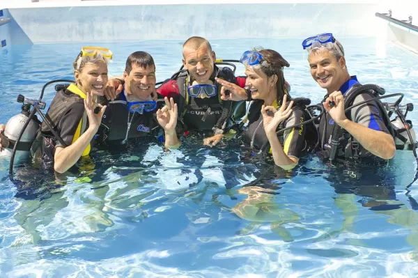 Travelers getting ready to scuba dive.
