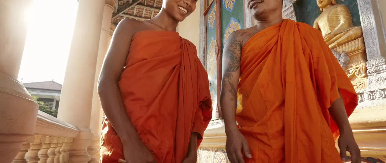 Monks conversing in a Buddist temple