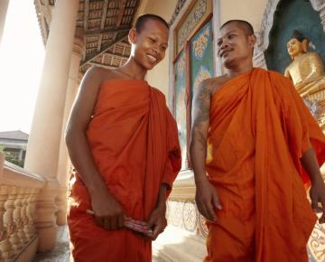 Monks conversing in a Buddist temple