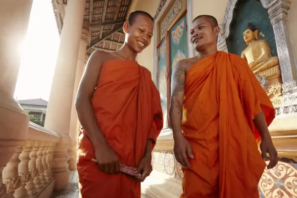Monks conversing in a Buddist temple