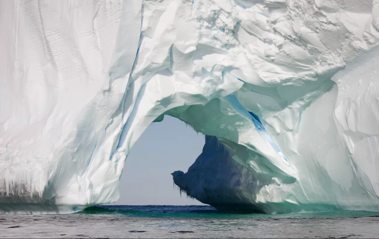 Antarctic iceberg arch.