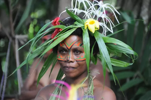 Local of Melanesia wears a traditional headdress.