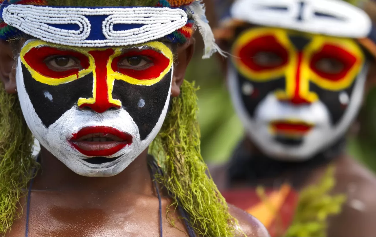 Locals of Papua New Guinea dressed in traditional headdress.