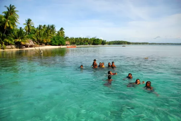 Swimming in the crystal blue waters of Papua New Guinea.