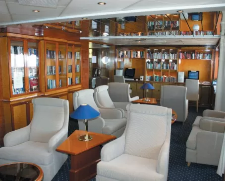 Relax in the library aboard the Island Sky.