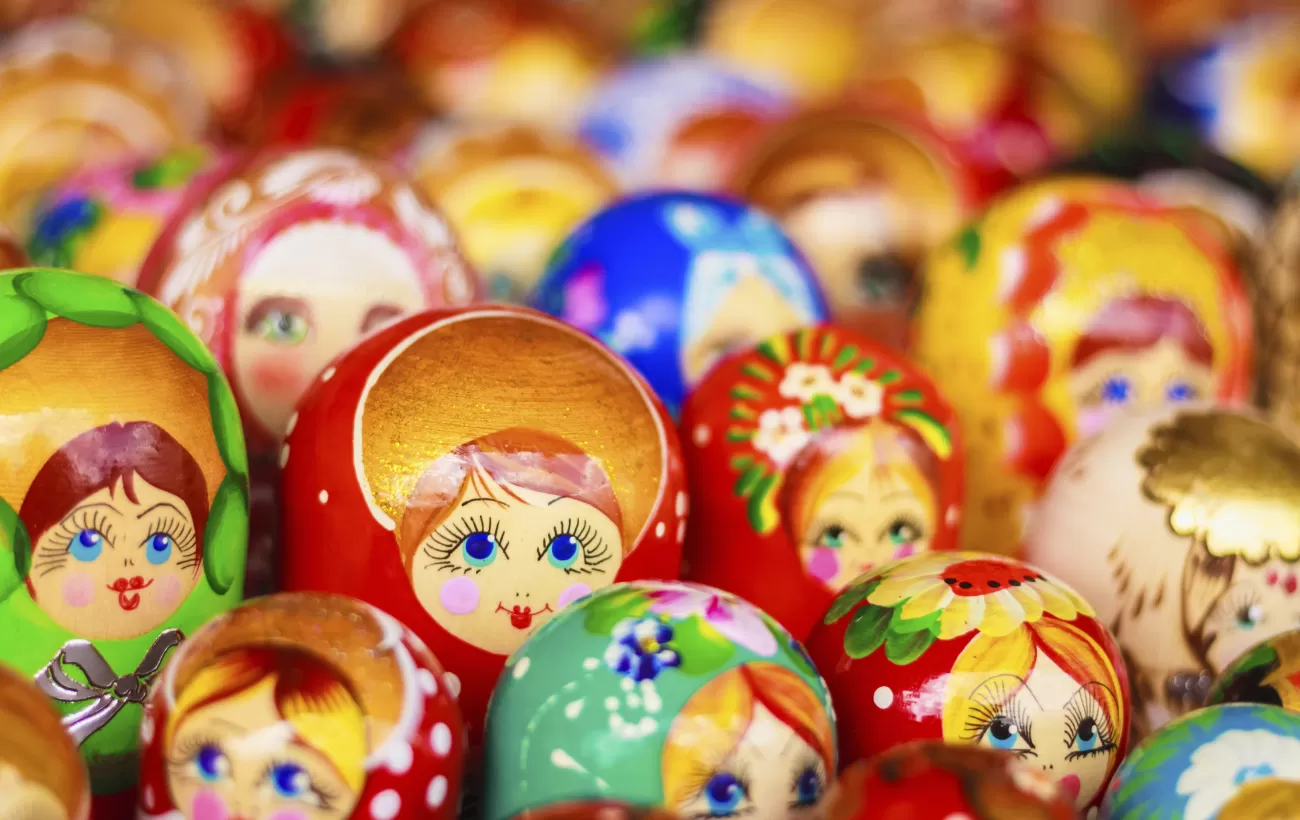 A cluster of multicolored matryoshka dolls.