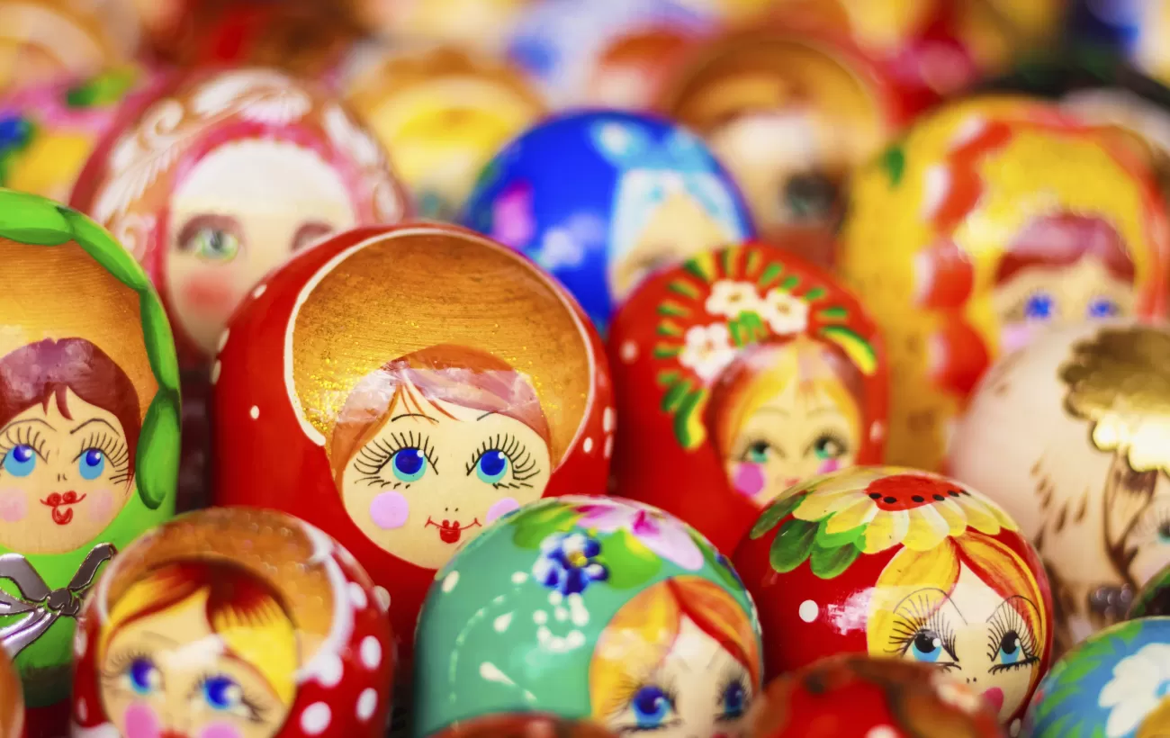 A cluster of multicolored matryoshka dolls.