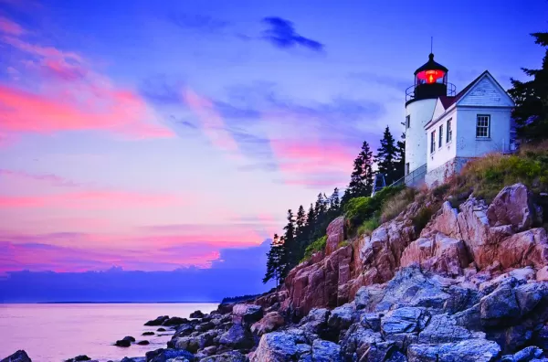 A beautiful lighthouse at sunset.