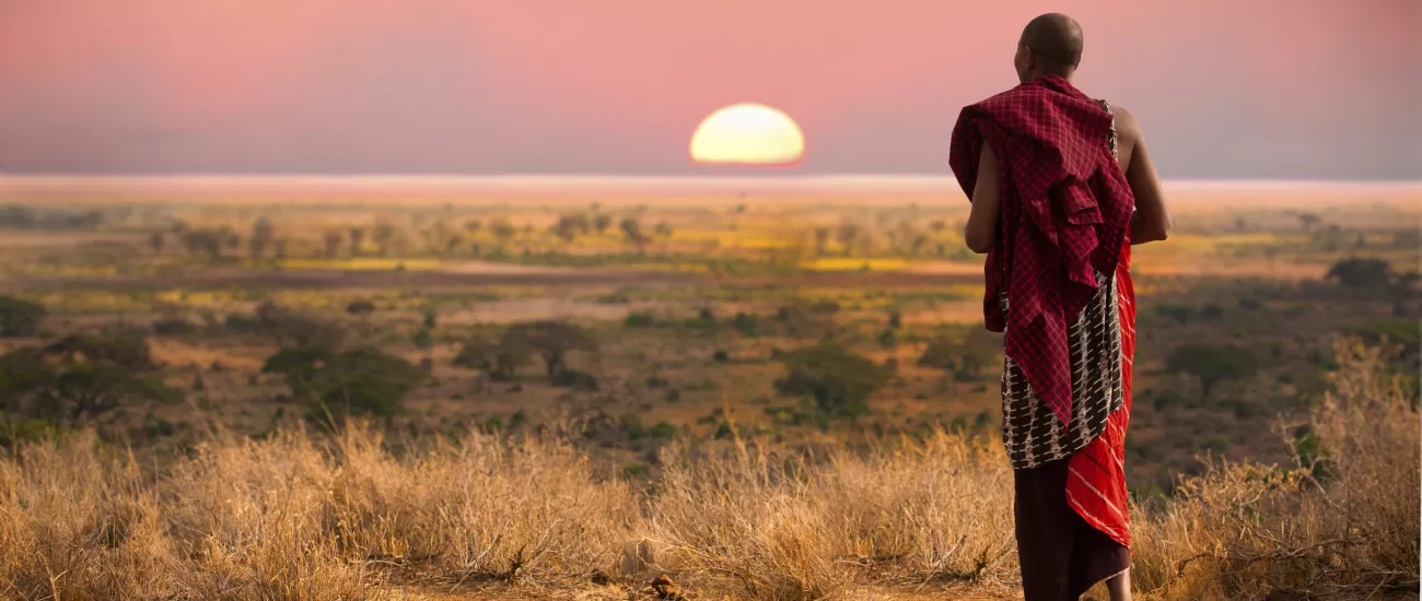 A local of Africa walking into the sunset.