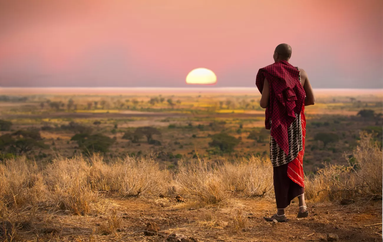 A local of Africa walking into the sunset.