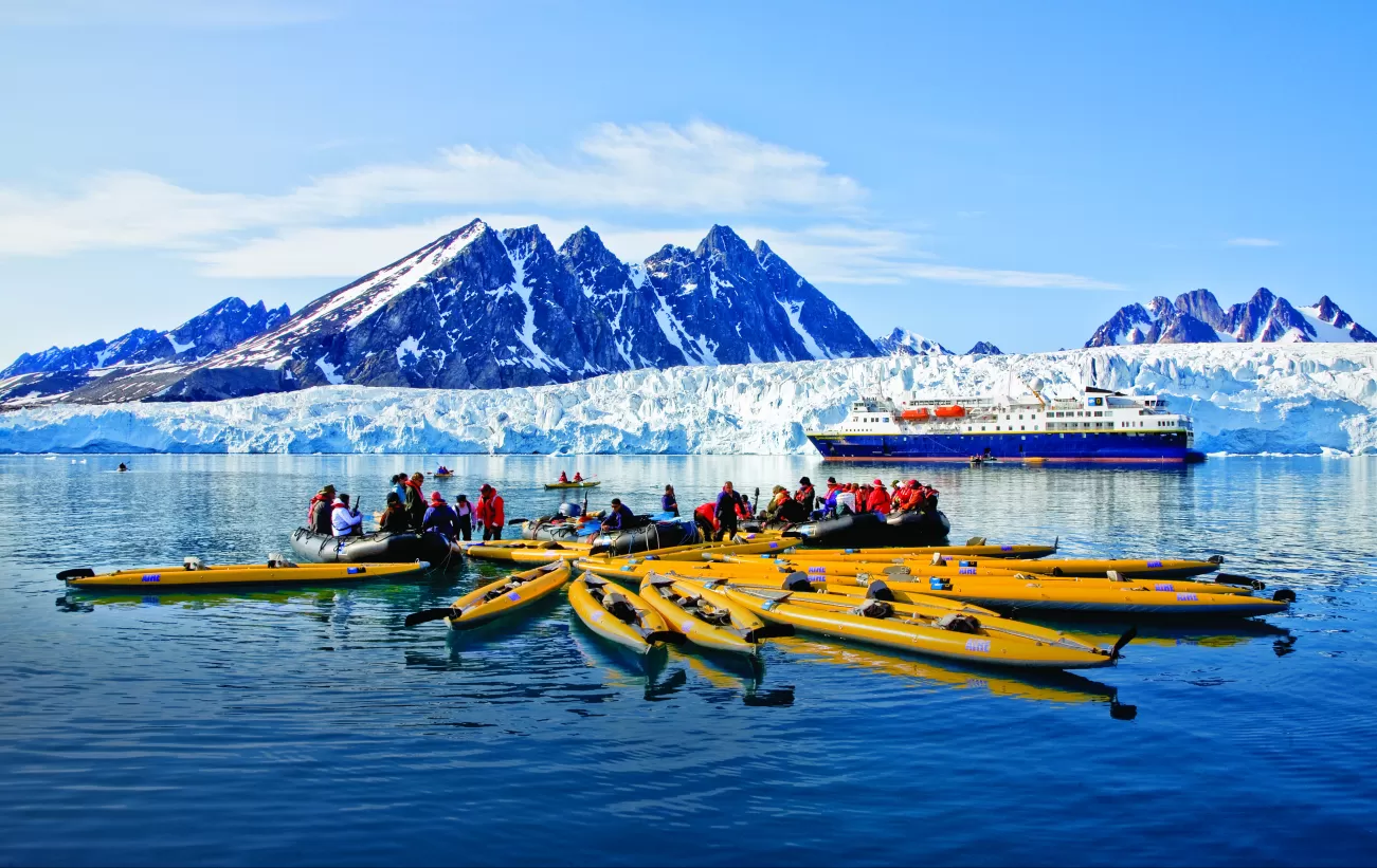 Taking a kayaking trip around Monaco Glacier on Spitsbergen Island.